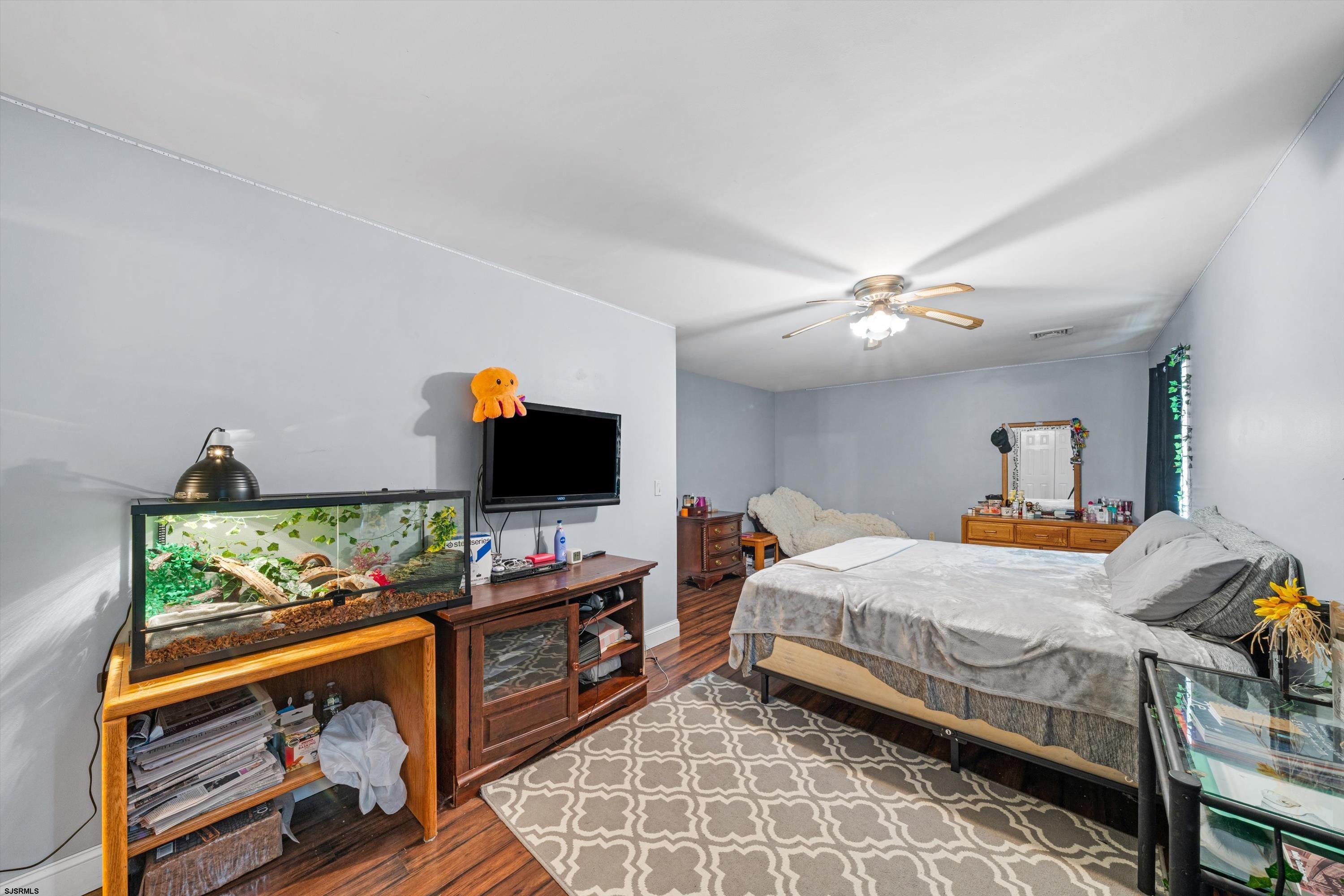 1319 Somers Point Road Egg Harbor Township, NJ 08234 - Photo 61 of 83 a bedroom with a bed and flat screen tv