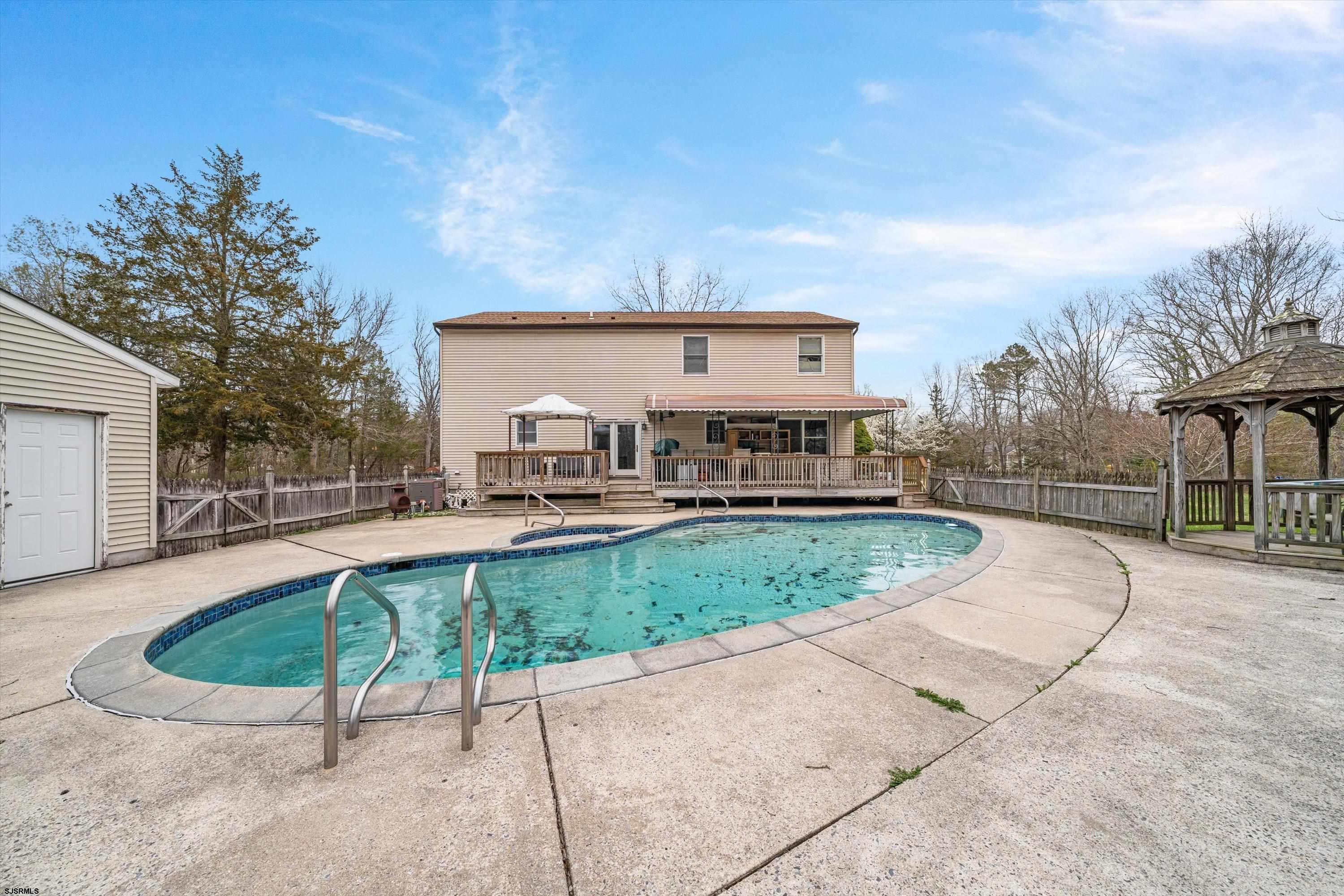 1319 Somers Point Road Egg Harbor Township, NJ 08234 - Photo 70 of 83 a view of a house with a yard patio and fire pit