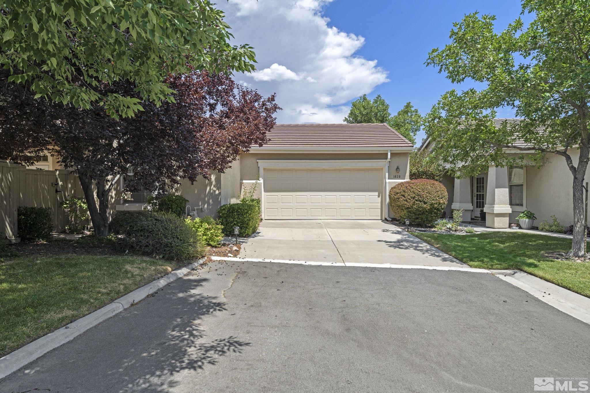 1620 Rocky Cove Lane Reno, NV 89521 - Photo 1 of 35 front view of house with a yard and trees all around