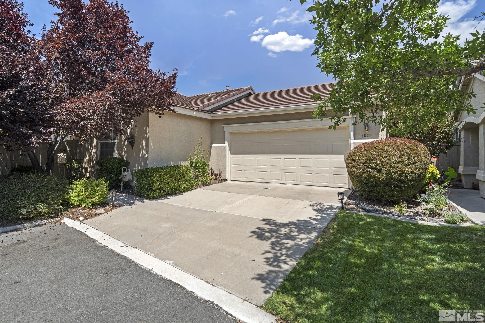 1620 Rocky Cove Lane Reno, NV 89521 - Photo 3 of 35 a backyard of a house with lots of green space