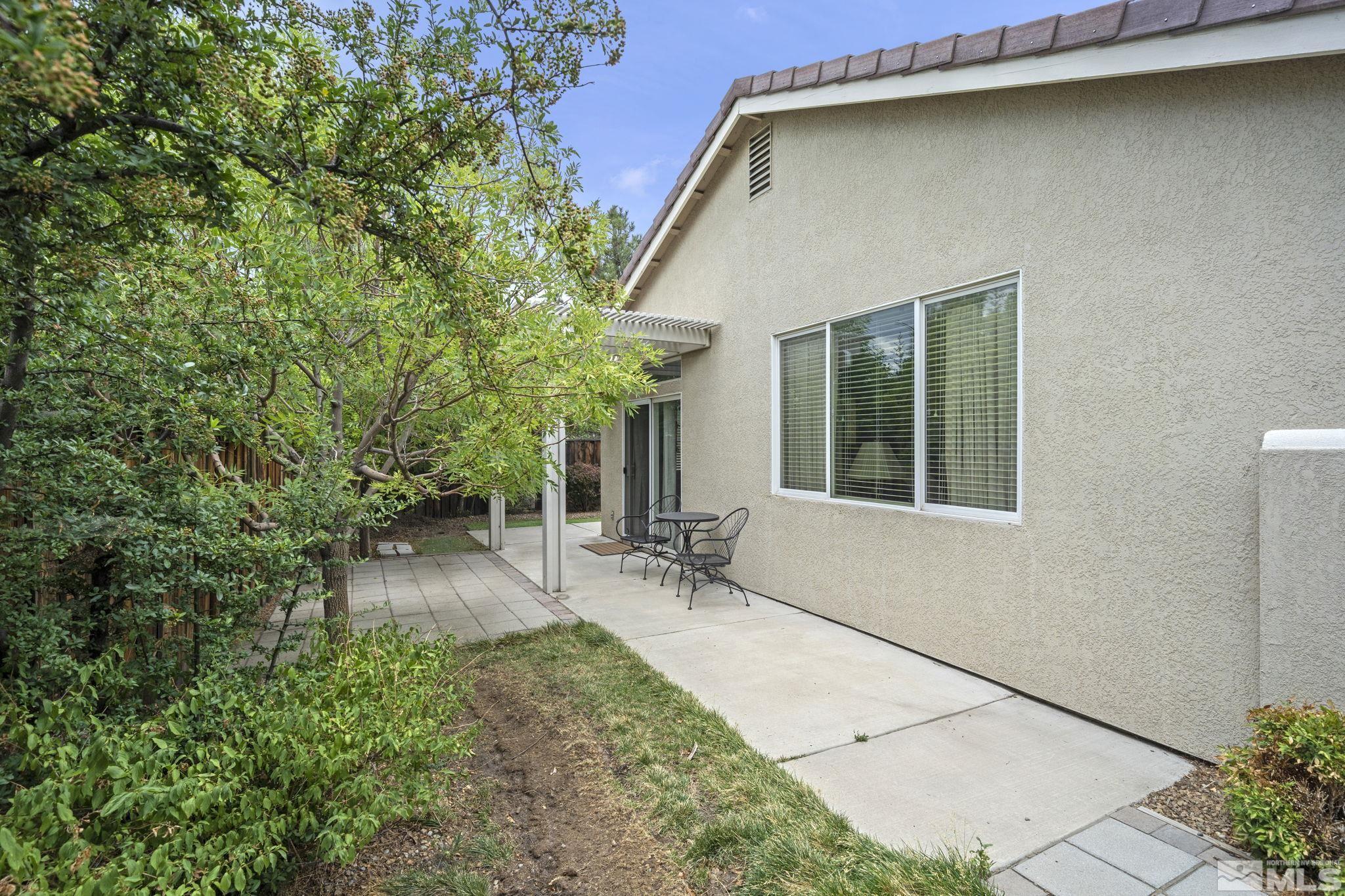 1620 Rocky Cove Lane Reno, NV 89521 - Photo 33 of 35 a backyard of a house with outdoor seating