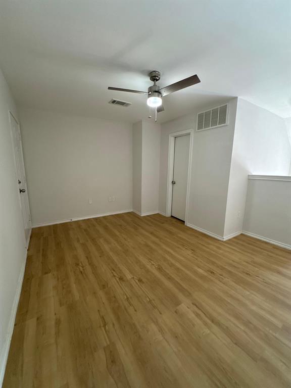 9837 Walnut Street, Unit 207 Dallas, TX 75243 - Photo 10 of 10 a view of empty room with wooden floor