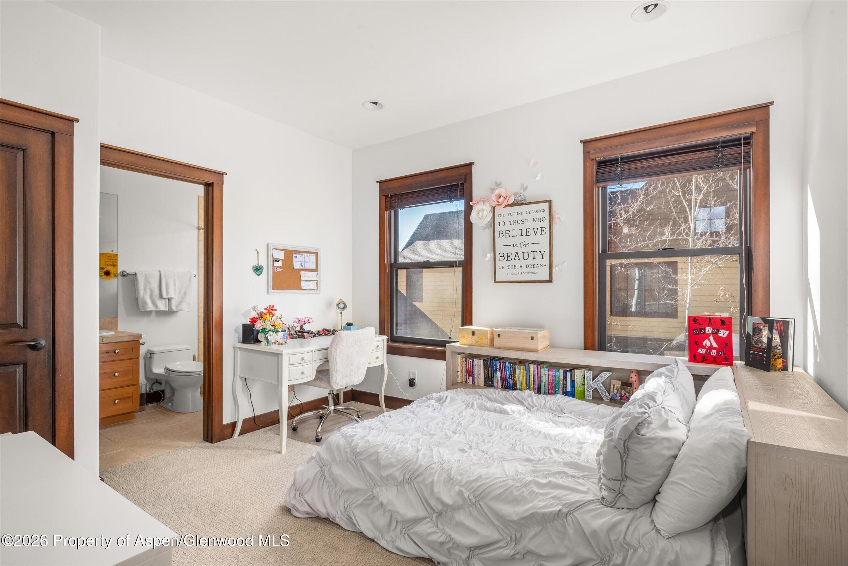 410 Meadow Court Basalt, CO 81621 - Photo 24 of 30 a bedroom with a bed and a large window