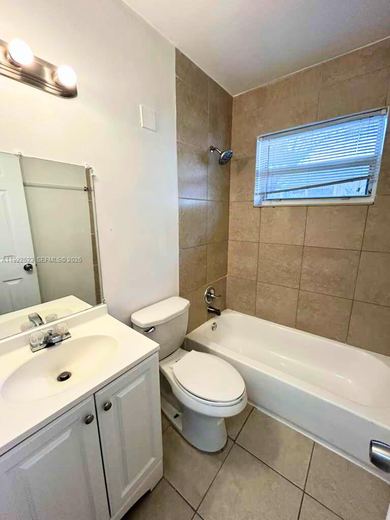 1265 Southwest 6th Street, Unit 10 Miami, FL 33135 - Photo 7 of 7 a bathroom with a sink a toilet and bathtub