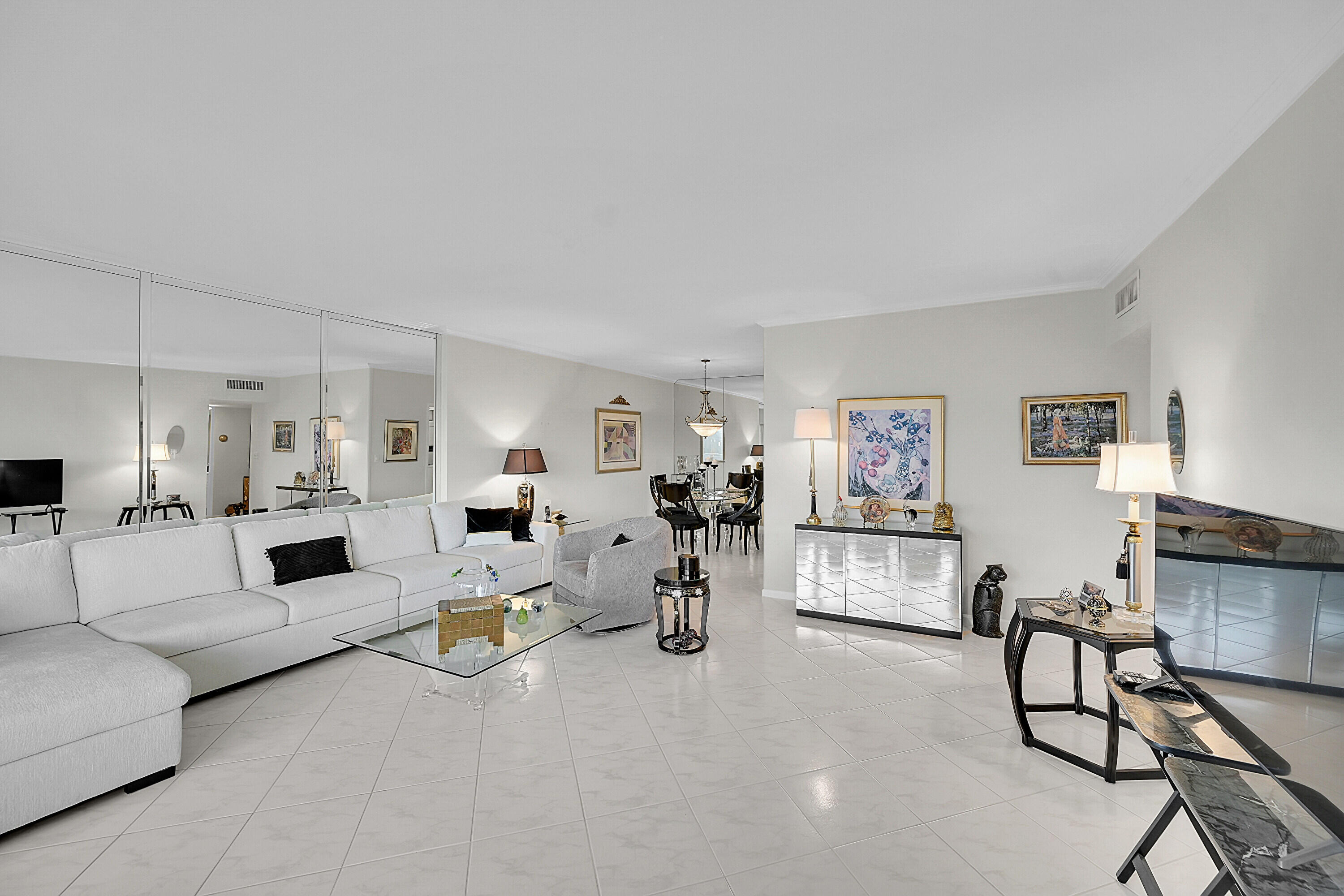 701 East Camino Real, Unit 4B Boca Raton, FL 33432 - Photo 11 of 35 a living room with furniture and wooden floor