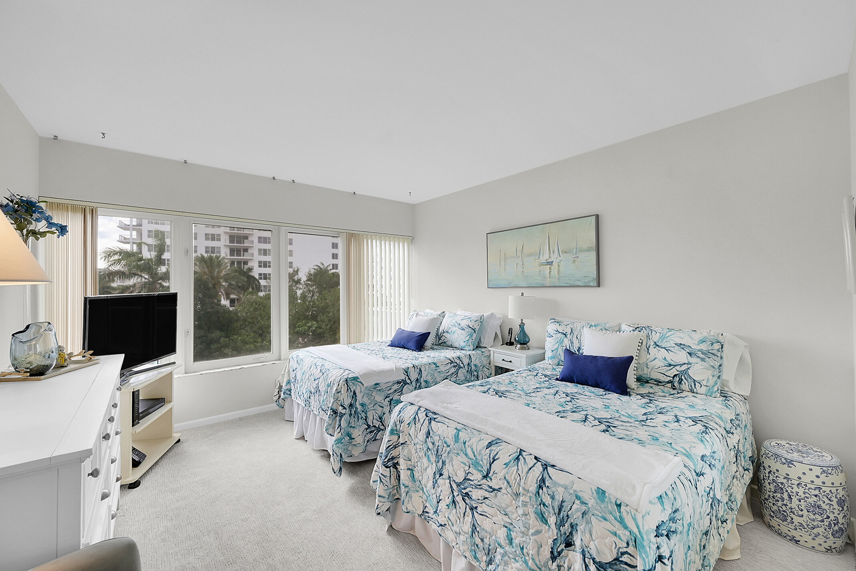 701 East Camino Real, Unit 4B Boca Raton, FL 33432 - Photo 24 of 35 a bedroom with double bed and large window