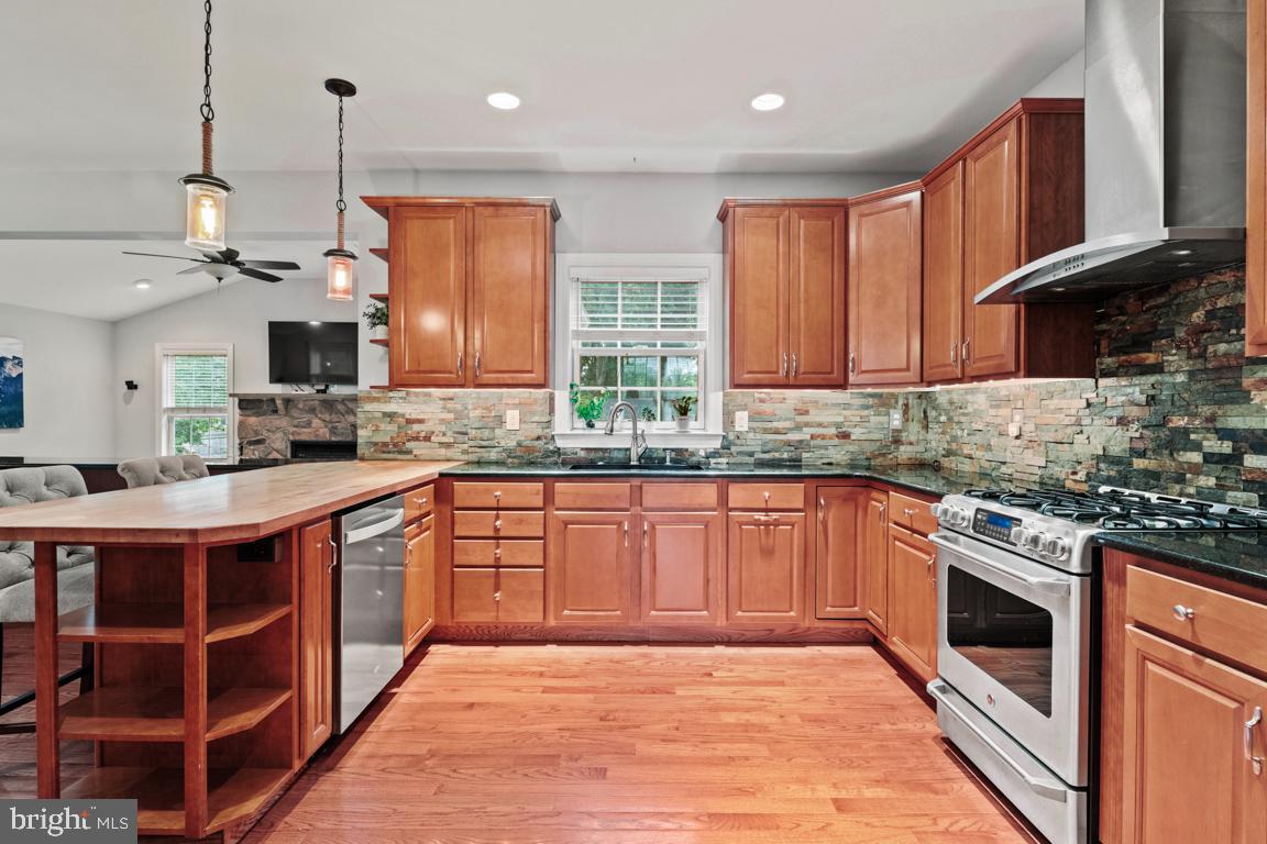 647 Schwab Road Hatfield, PA 19440 - Photo 8 of 39 Stone backsplash; wood floor