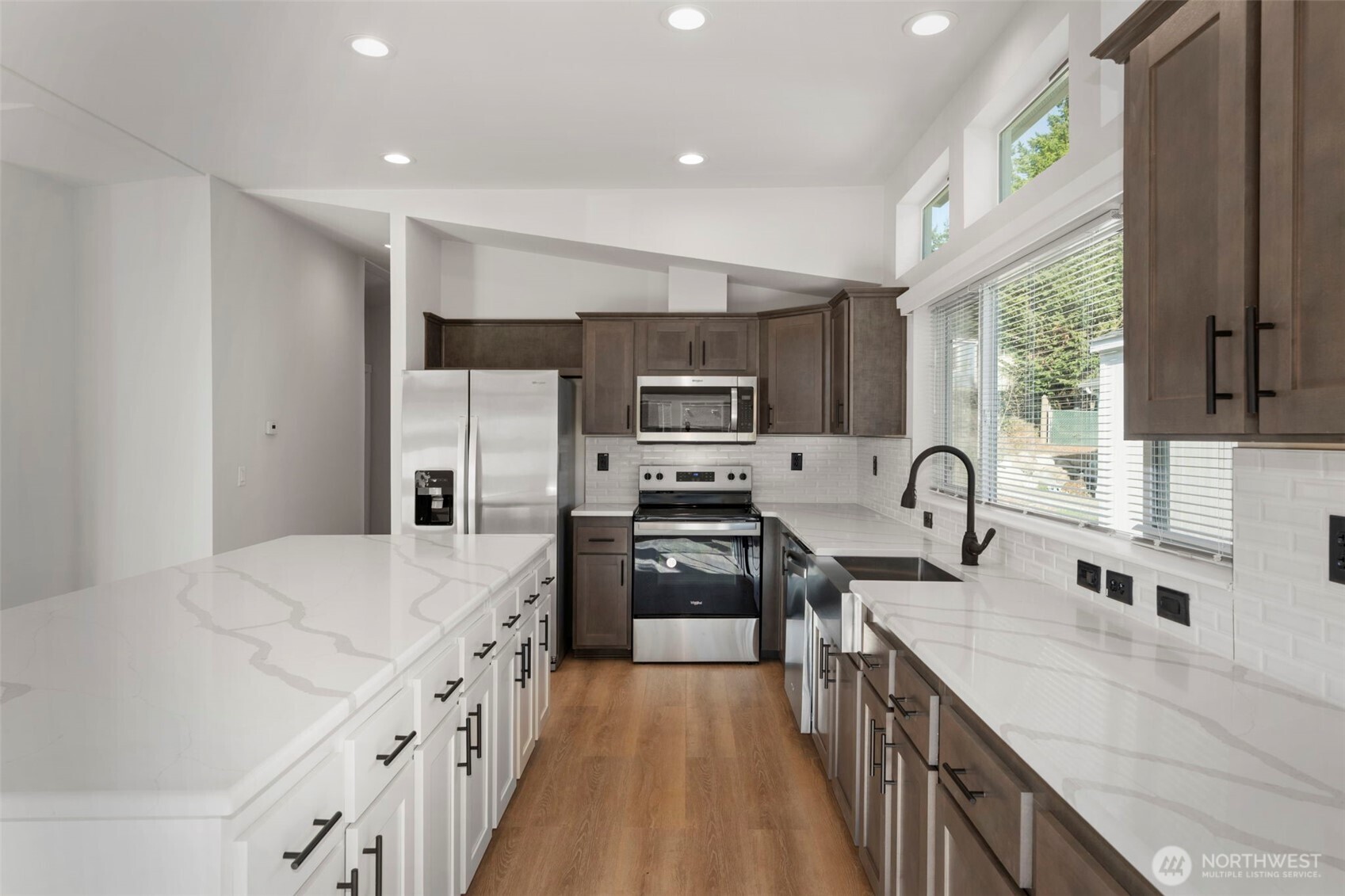 177 Sunset Meadows Lane Port Hadlock, WA 98339 - Photo 12 of 20 a kitchen with stainless steel appliances a sink dishwasher a stove a refrigerator with white cabinets and wooden floor