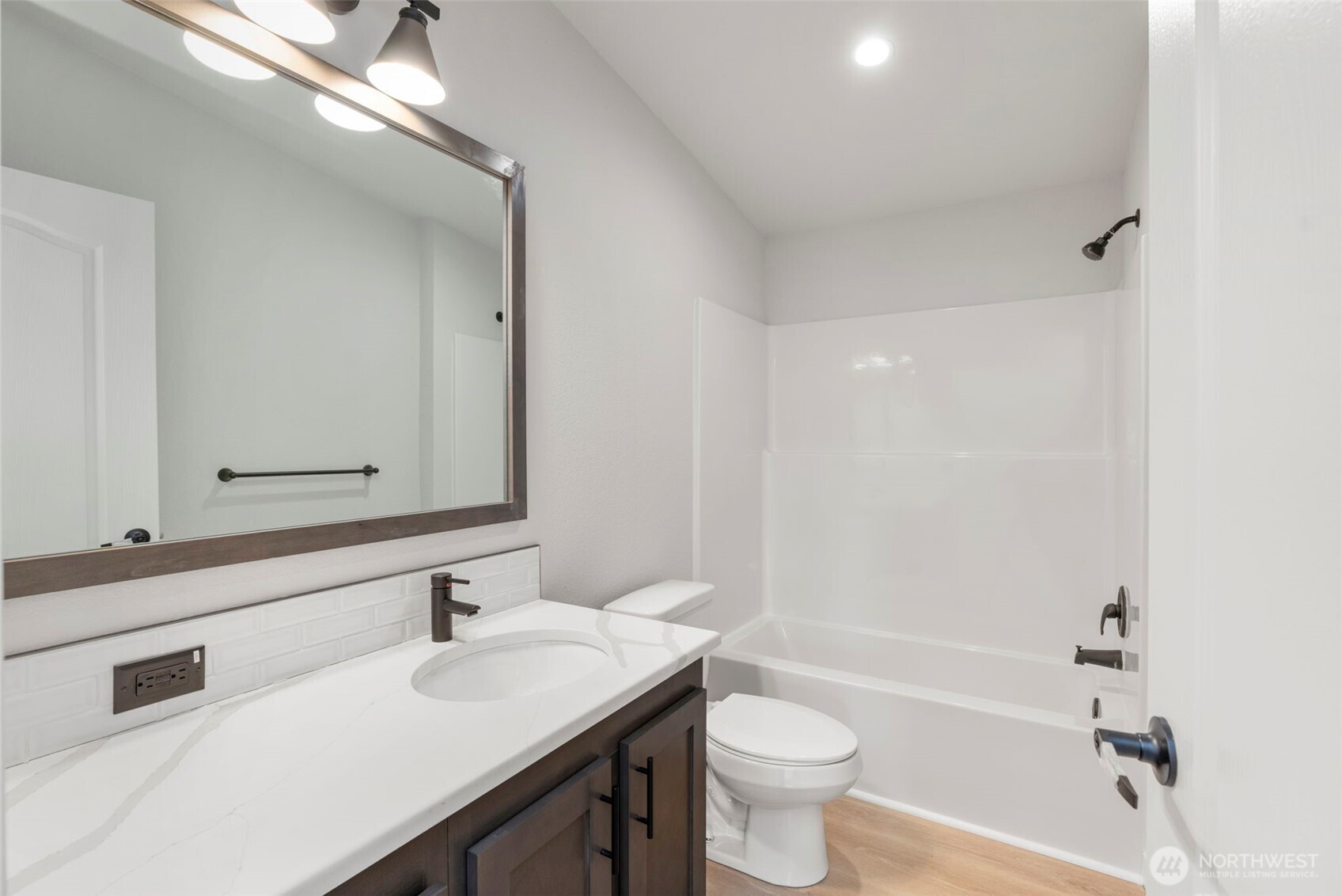 177 Sunset Meadows Lane Port Hadlock, WA 98339 - Photo 17 of 20 a bathroom with a sink a toilet a mirror and bathtub