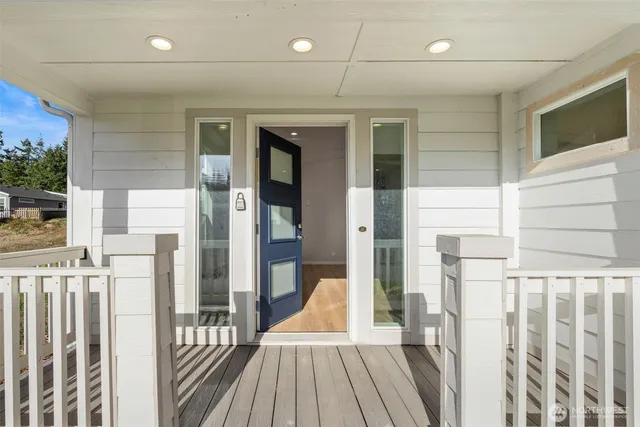 a view of a balcony with wooden floor