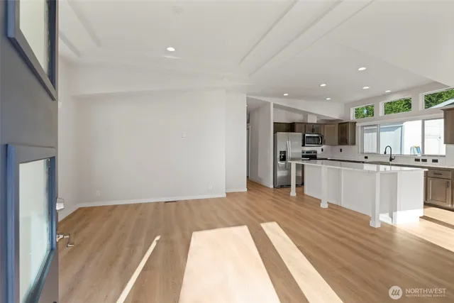 a view of kitchen with wooden floor