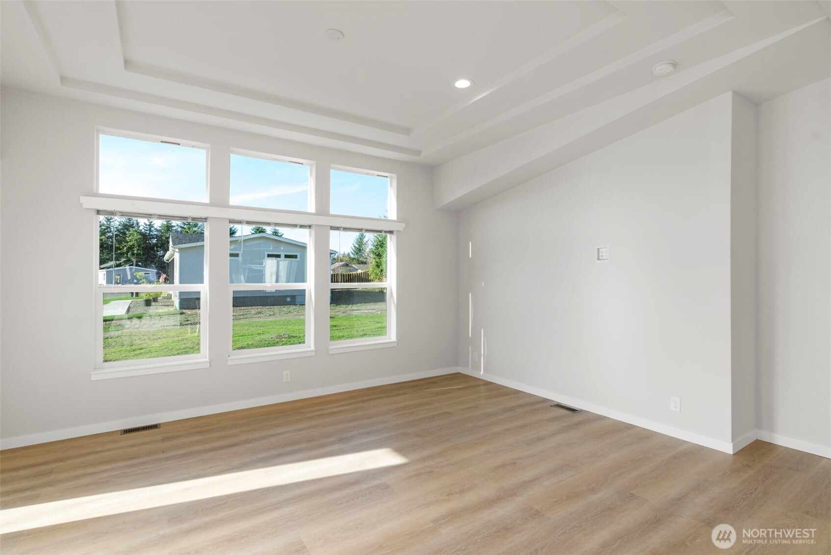 177 Sunset Meadows Lane Port Hadlock, WA 98339 - Photo 8 of 20 a view of empty room with wooden floor and fan