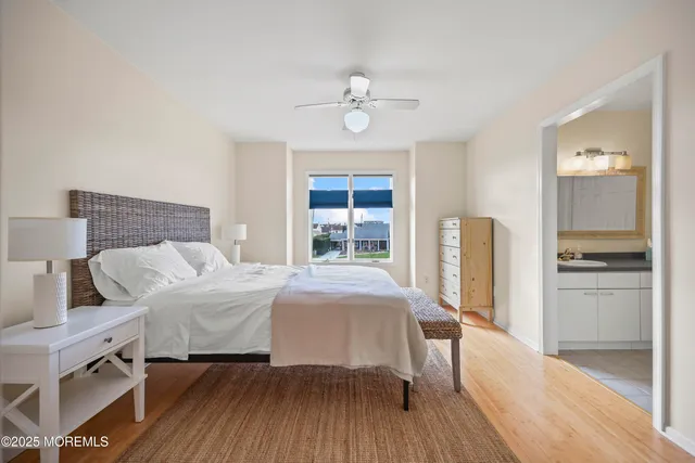 a bedroom with a bed dresser and a window