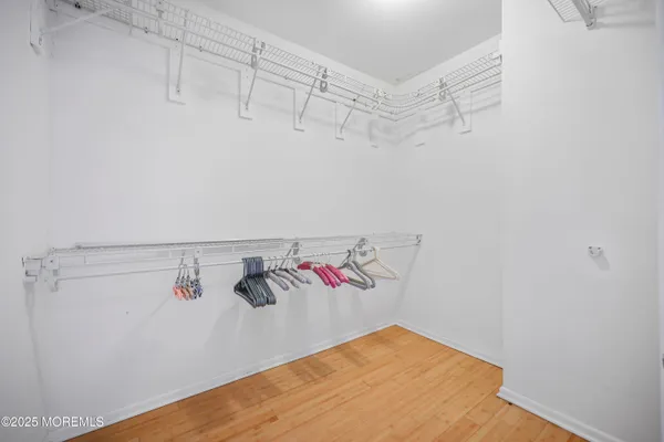 a view of a house with large windows and a yard