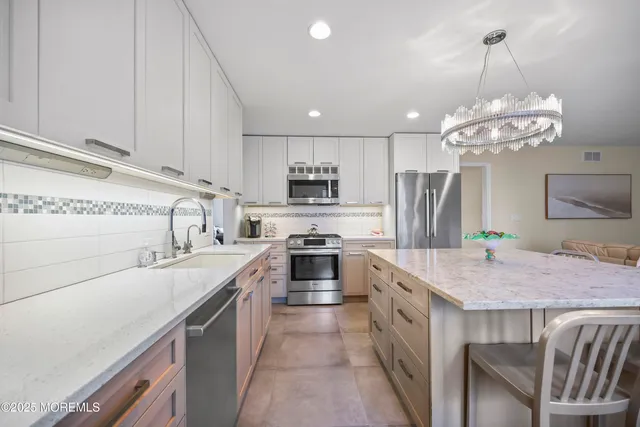 a view of a dining room with furniture and window