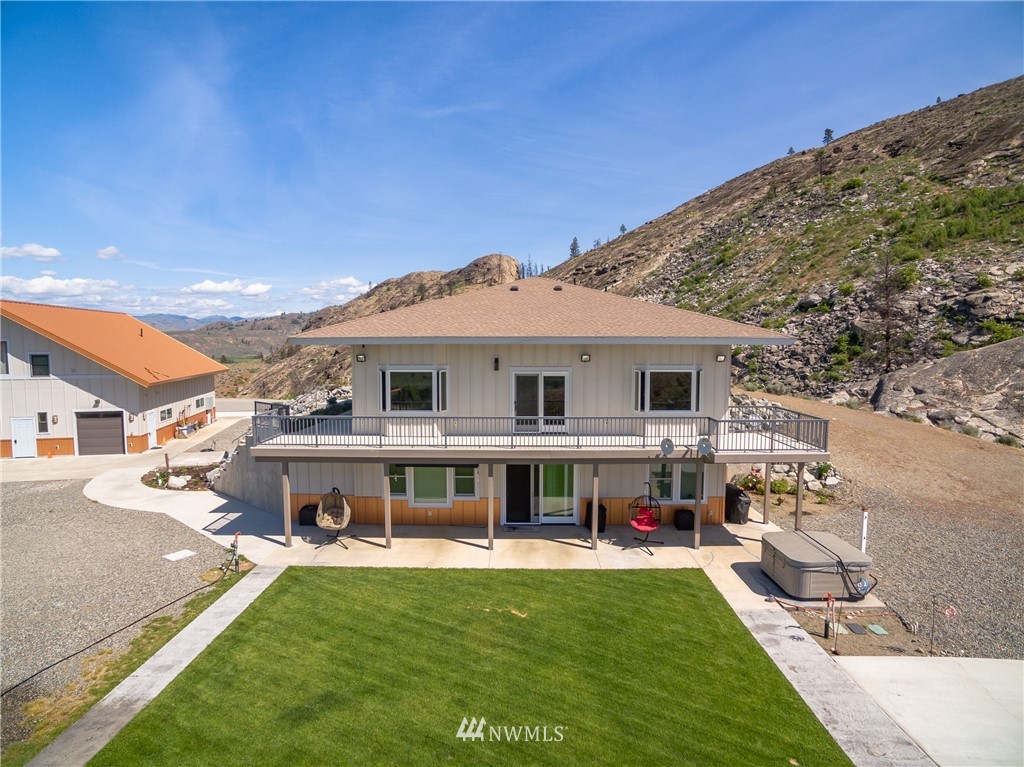 70 B Tunk Creek Road Riverside, WA 98849 - Photo 1 of 40 a view of house with swimming pool and furniture