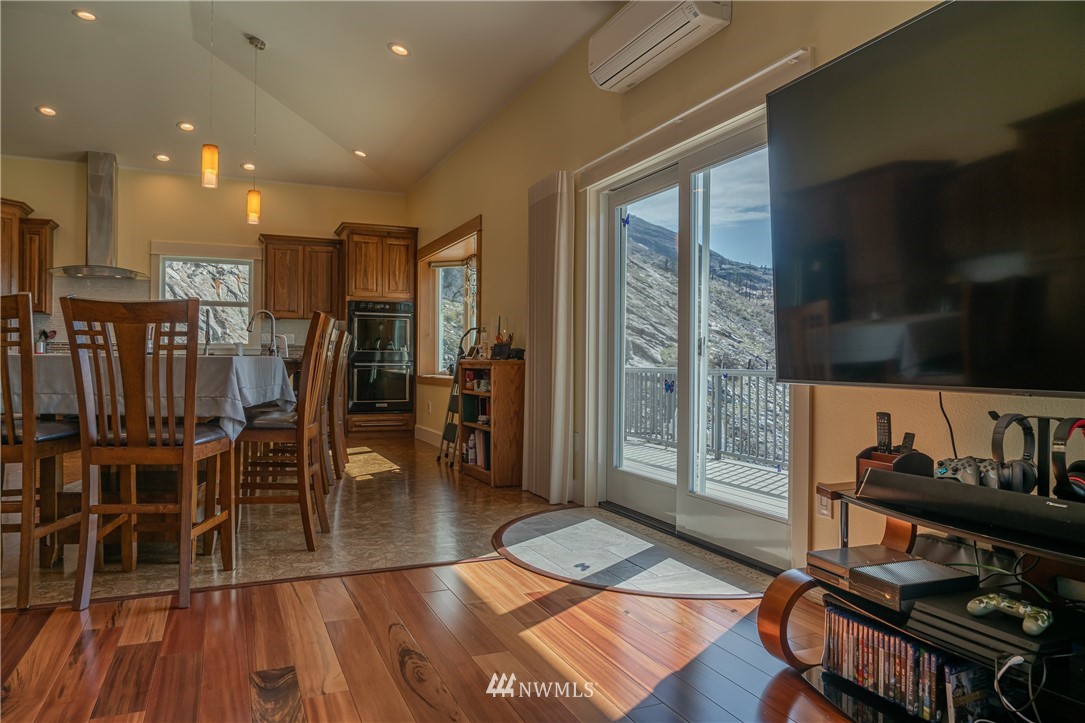 70 B Tunk Creek Road Riverside, WA 98849 - Photo 11 of 40 a view of a kitchen with furniture and wooden floor