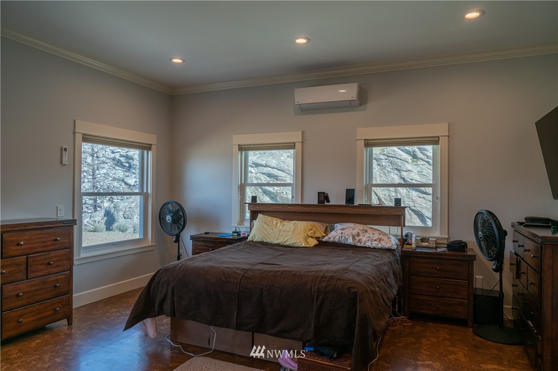70 B Tunk Creek Road Riverside, WA 98849 - Photo 18 of 40 a bedroom with a bed and a window