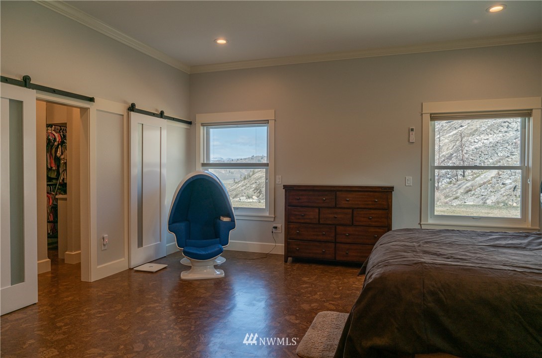 70 B Tunk Creek Road Riverside, WA 98849 - Photo 19 of 40 a bed room with a bed and a window