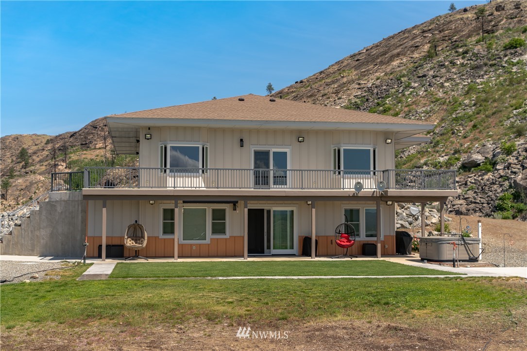 70 B Tunk Creek Road Riverside, WA 98849 - Photo 3 of 40 a front view of a house with a garden
