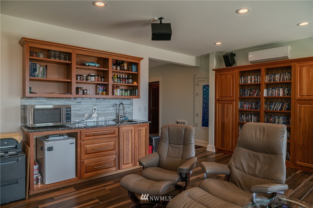 70 B Tunk Creek Road Riverside, WA 98849 - Photo 24 of 40 a living room with furniture and a book shelf