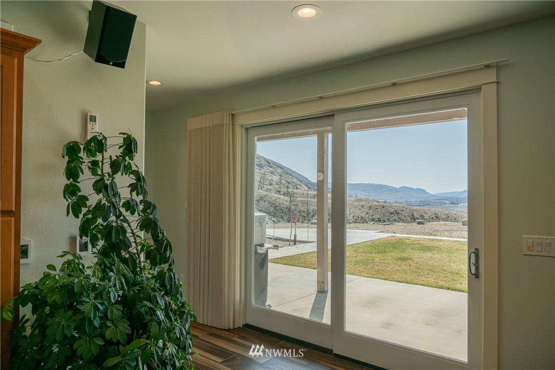 70 B Tunk Creek Road Riverside, WA 98849 - Photo 26 of 40 a view of a room with a floor to ceiling window and wooden floor