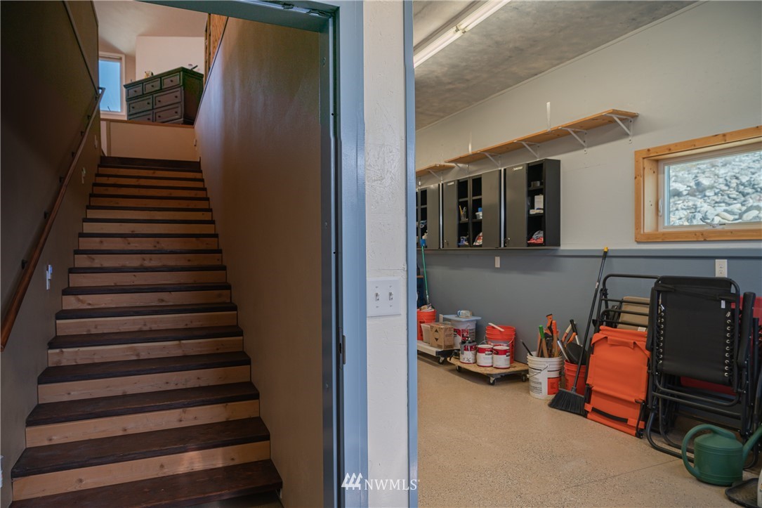 70 B Tunk Creek Road Riverside, WA 98849 - Photo 35 of 40 a view of a livingroom with furniture and stairs
