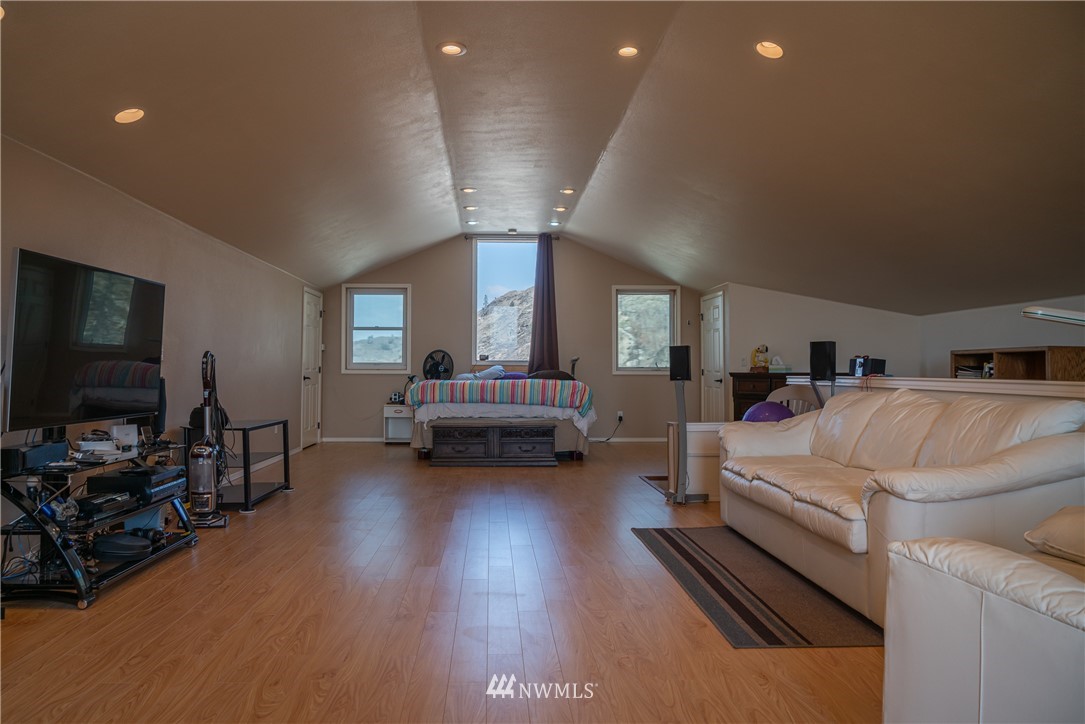 70 B Tunk Creek Road Riverside, WA 98849 - Photo 36 of 40 a living room with furniture and a flat screen tv