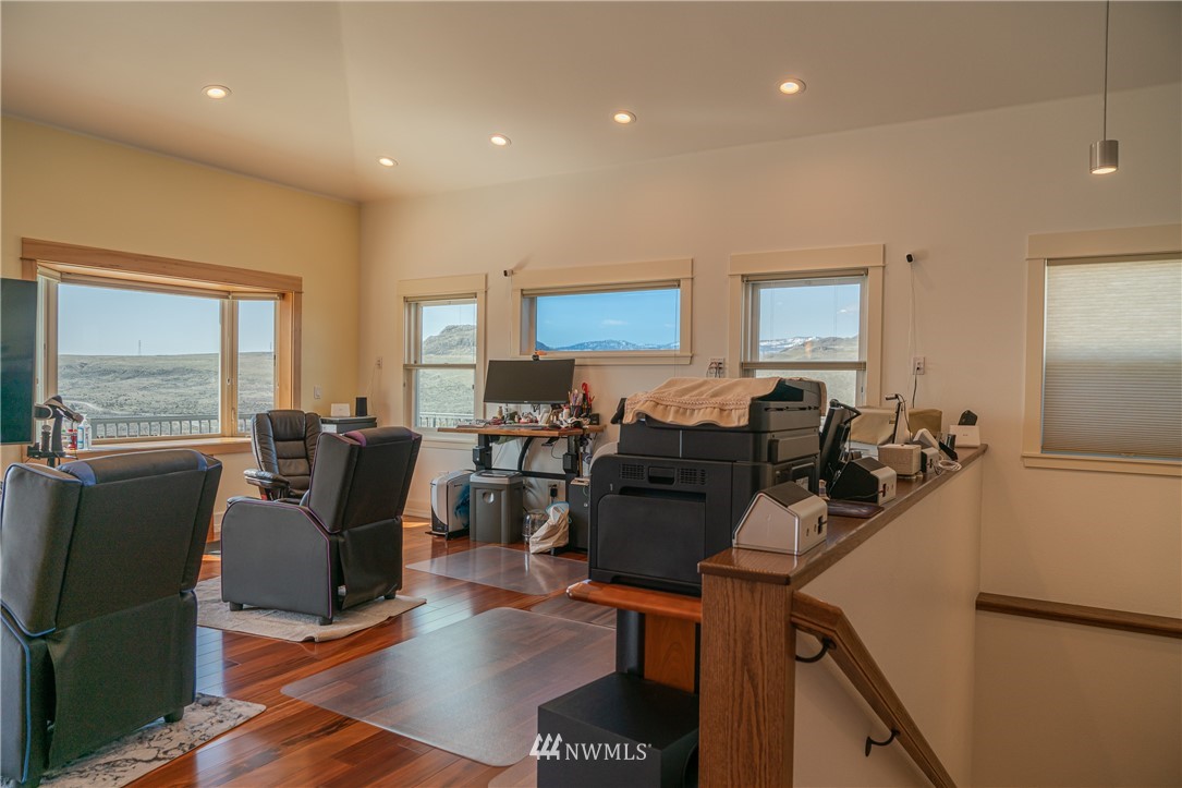 70 B Tunk Creek Road Riverside, WA 98849 - Photo 7 of 40 a living room with furniture a large window and a dining table