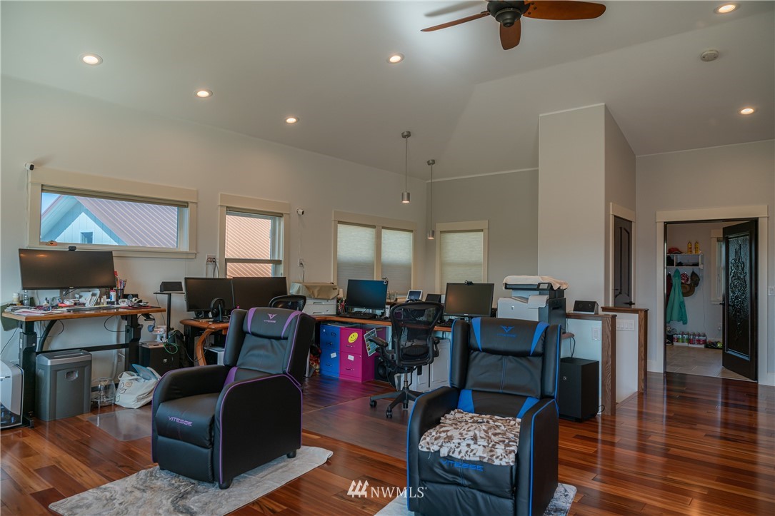 70 B Tunk Creek Road Riverside, WA 98849 - Photo 8 of 40 a living room with furniture and a wooden floor