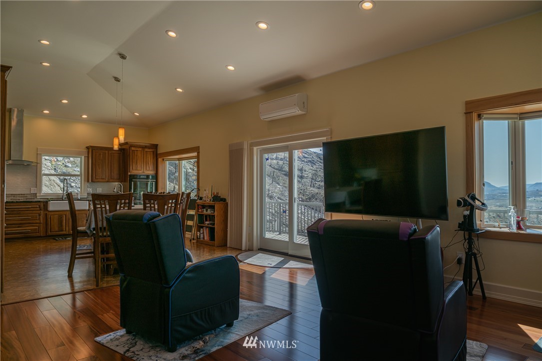 70 B Tunk Creek Road Riverside, WA 98849 - Photo 9 of 40 a living room with furniture and a flat screen tv