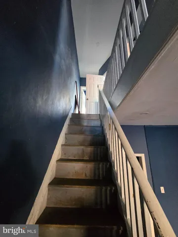 a bathroom with a sink toilet and window