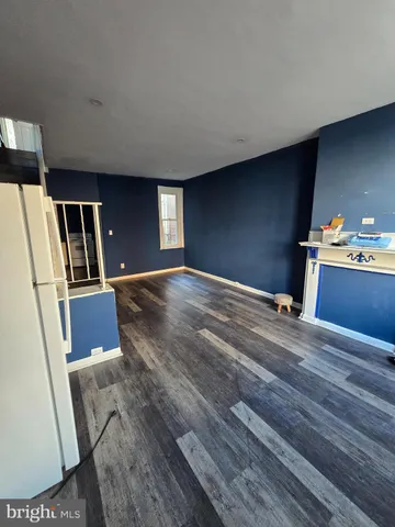 a view of a livingroom with wooden floor