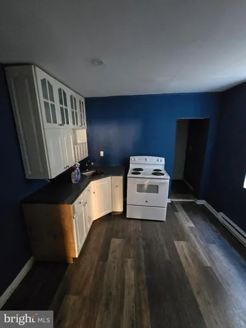 a view of a hallway with washer and dryer