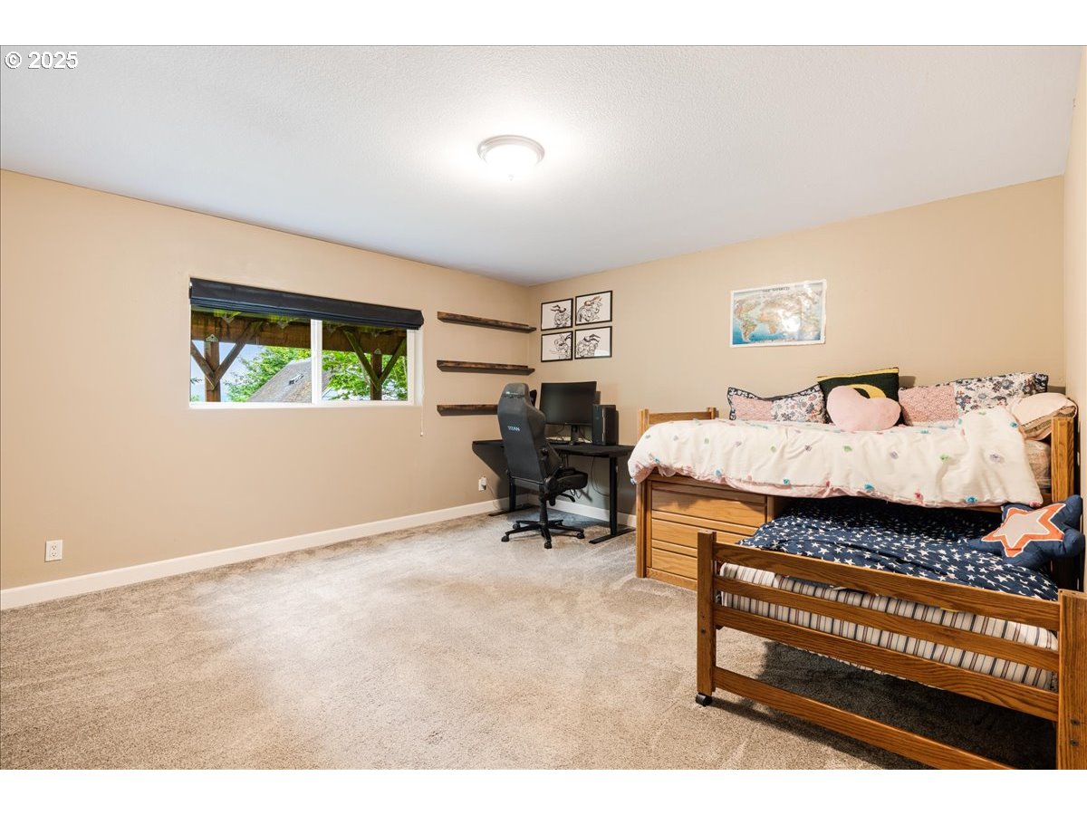 30062 Maple Drive Rainier, OR 97048 - Photo 18 of 47 a bedroom with furniture and a window
