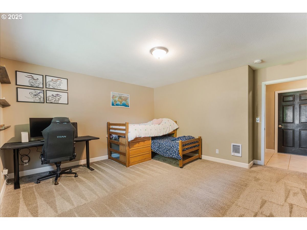 30062 Maple Drive Rainier, OR 97048 - Photo 19 of 47 a bedroom with furniture and a wooden floor