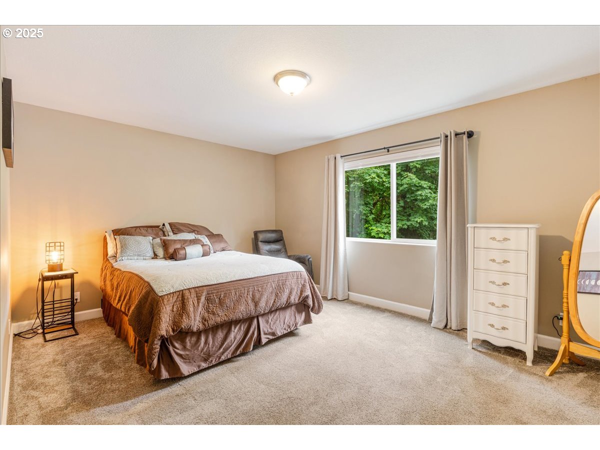 30062 Maple Drive Rainier, OR 97048 - Photo 21 of 47 a bedroom with a bed and a closet