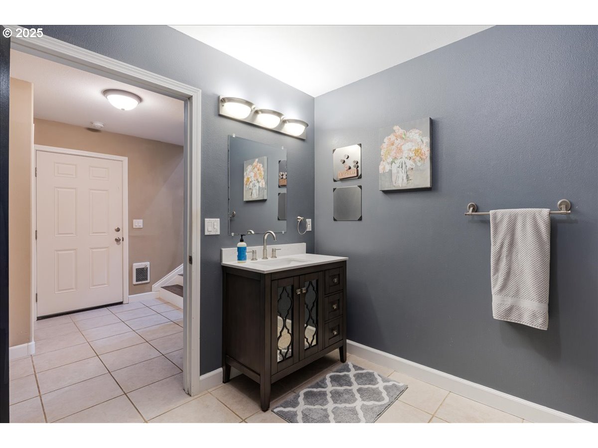 30062 Maple Drive Rainier, OR 97048 - Photo 25 of 47 a spacious bathroom with a sink a mirror and a vanity