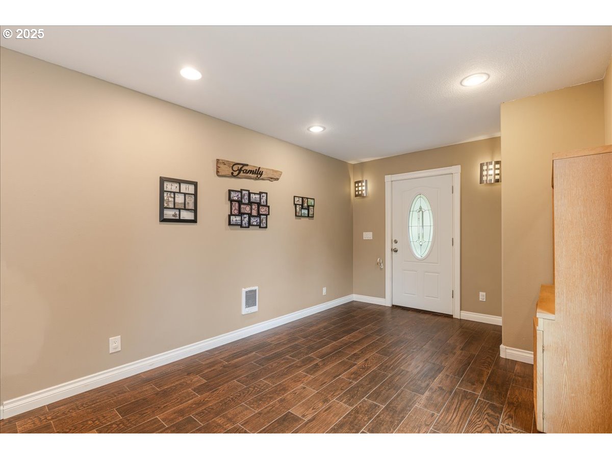 30062 Maple Drive Rainier, OR 97048 - Photo 26 of 47 a view of an empty room with wooden floor