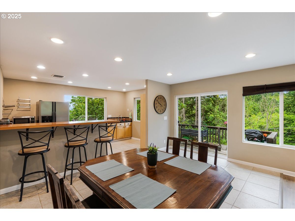 30062 Maple Drive Rainier, OR 97048 - Photo 3 of 47 a view of a dining room with furniture window and outside view