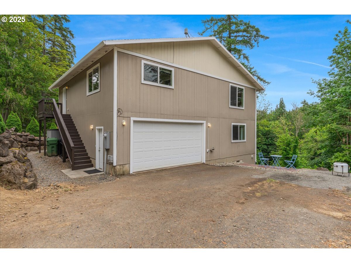 30062 Maple Drive Rainier, OR 97048 - Photo 33 of 47 a view of a house with a backyard