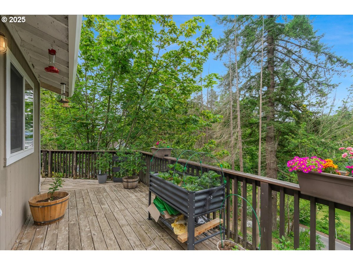30062 Maple Drive Rainier, OR 97048 - Photo 34 of 47 a balcony with wooden floor
