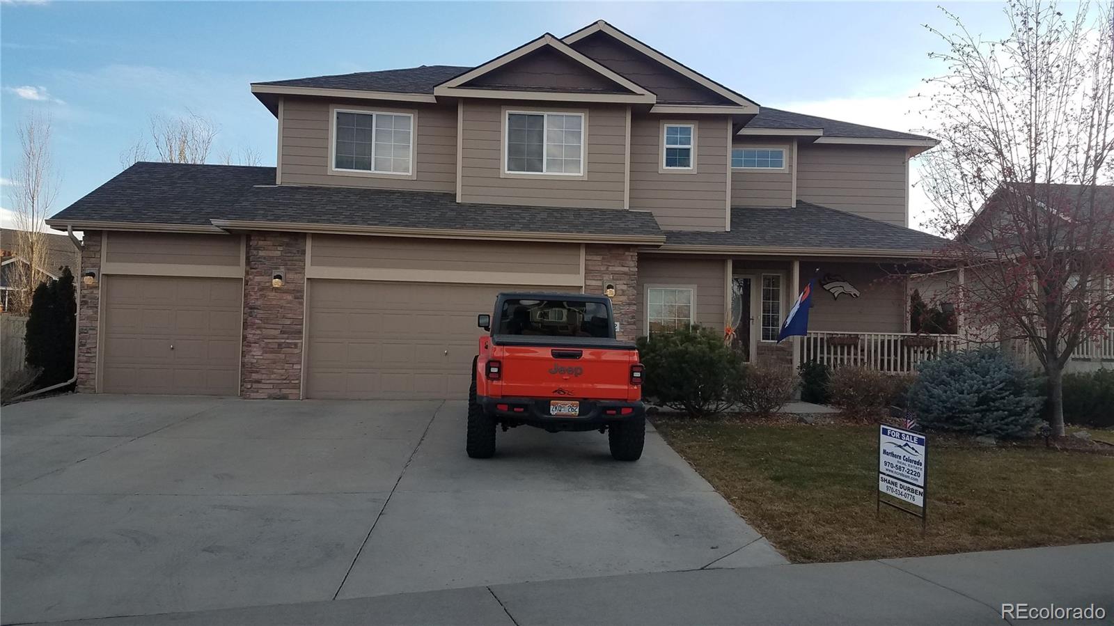 a front view of a house with a garage