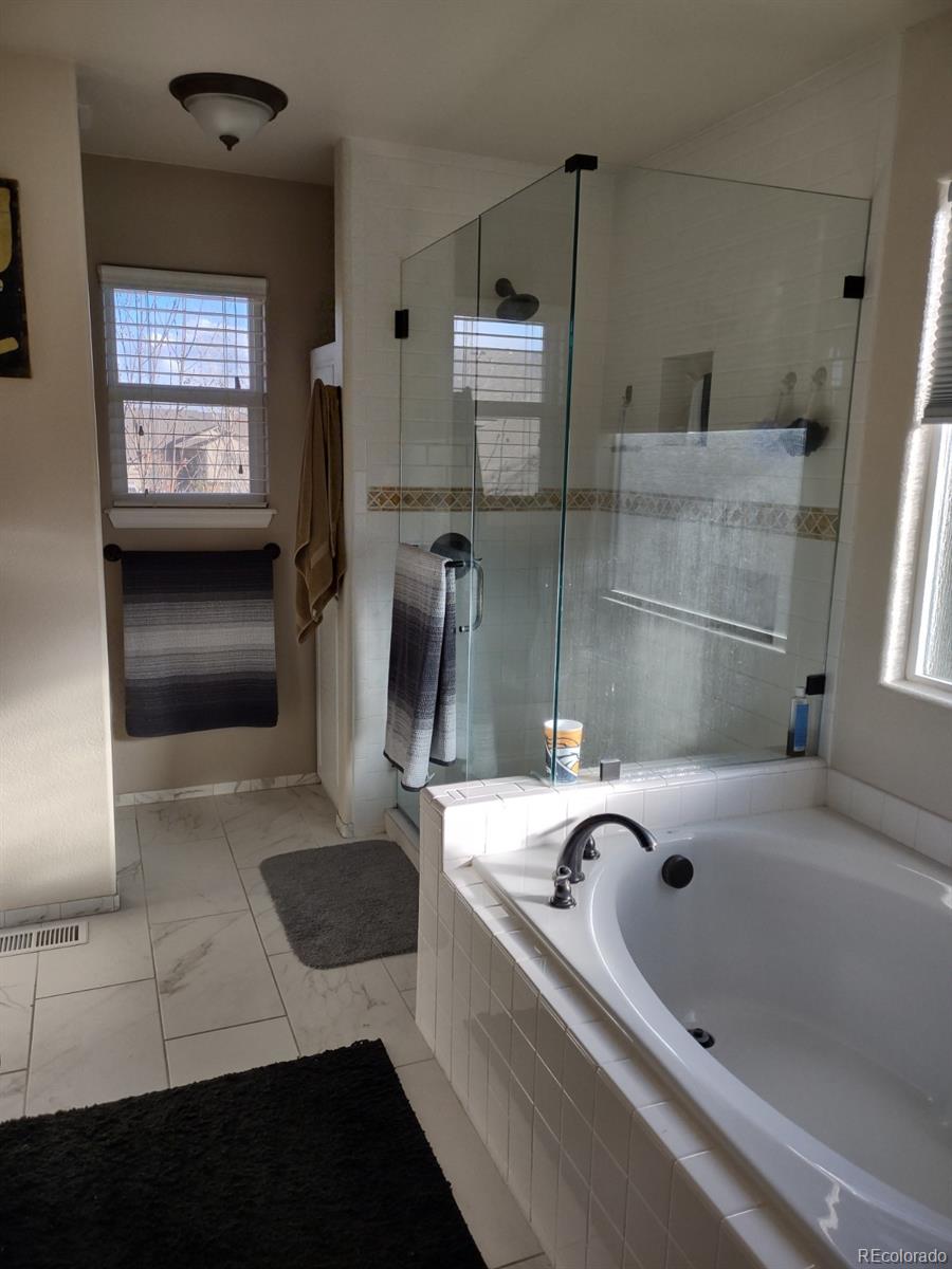 5342 Roadrunner Avenue Firestone, CO 80504 - Photo 13 of 21 a bathroom with a sink and a shower