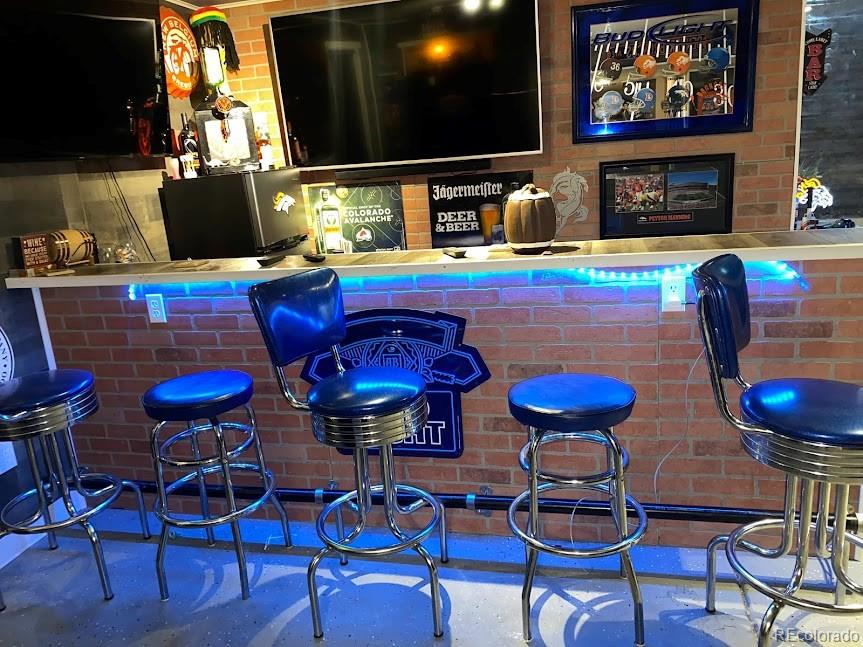 5342 Roadrunner Avenue Firestone, CO 80504 - Photo 16 of 21 a view of a dining room with furniture and wooden floor