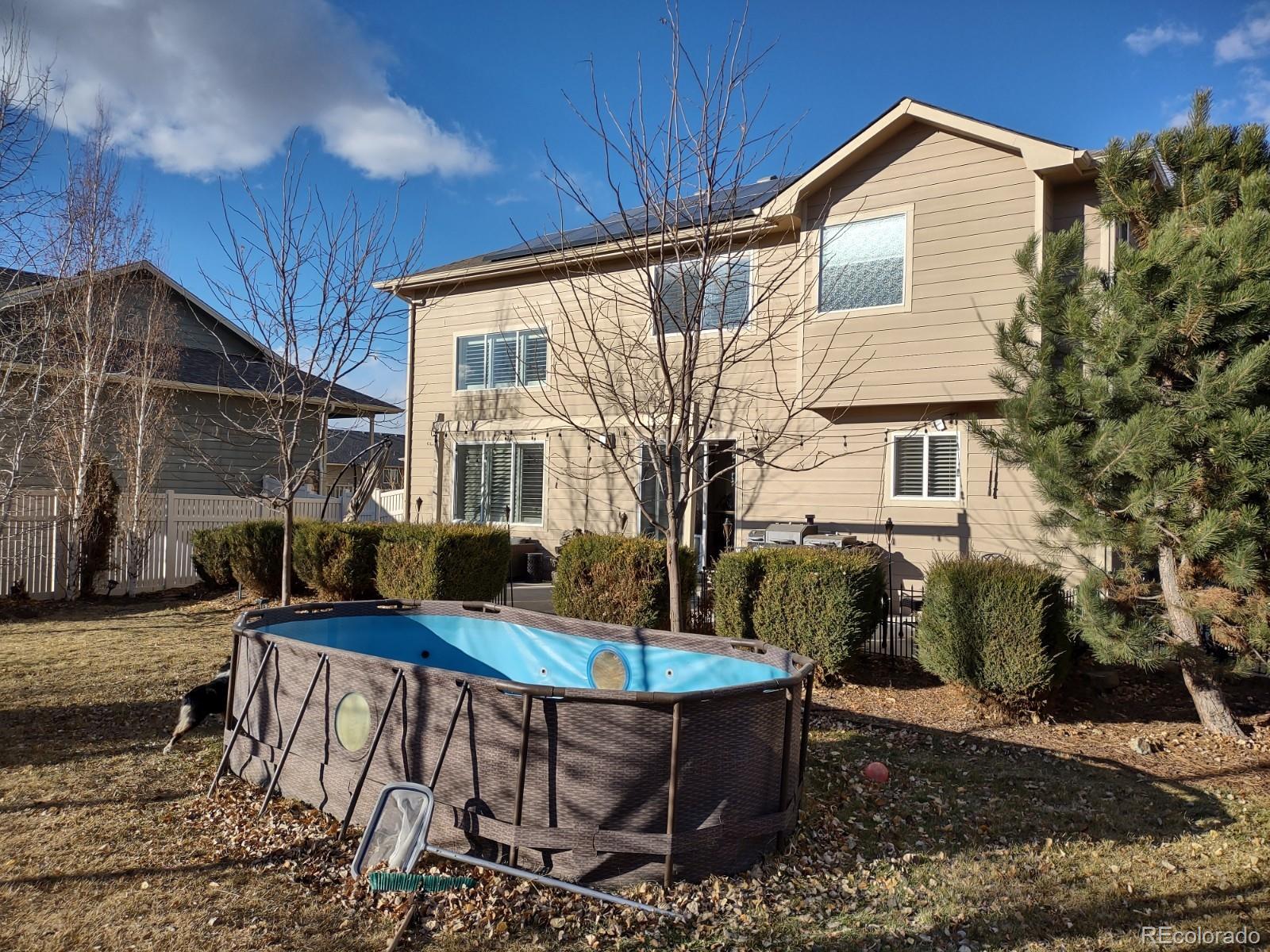 5342 Roadrunner Avenue Firestone, CO 80504 - Photo 18 of 21 a backyard of a house with yard fire pit and outdoor seating