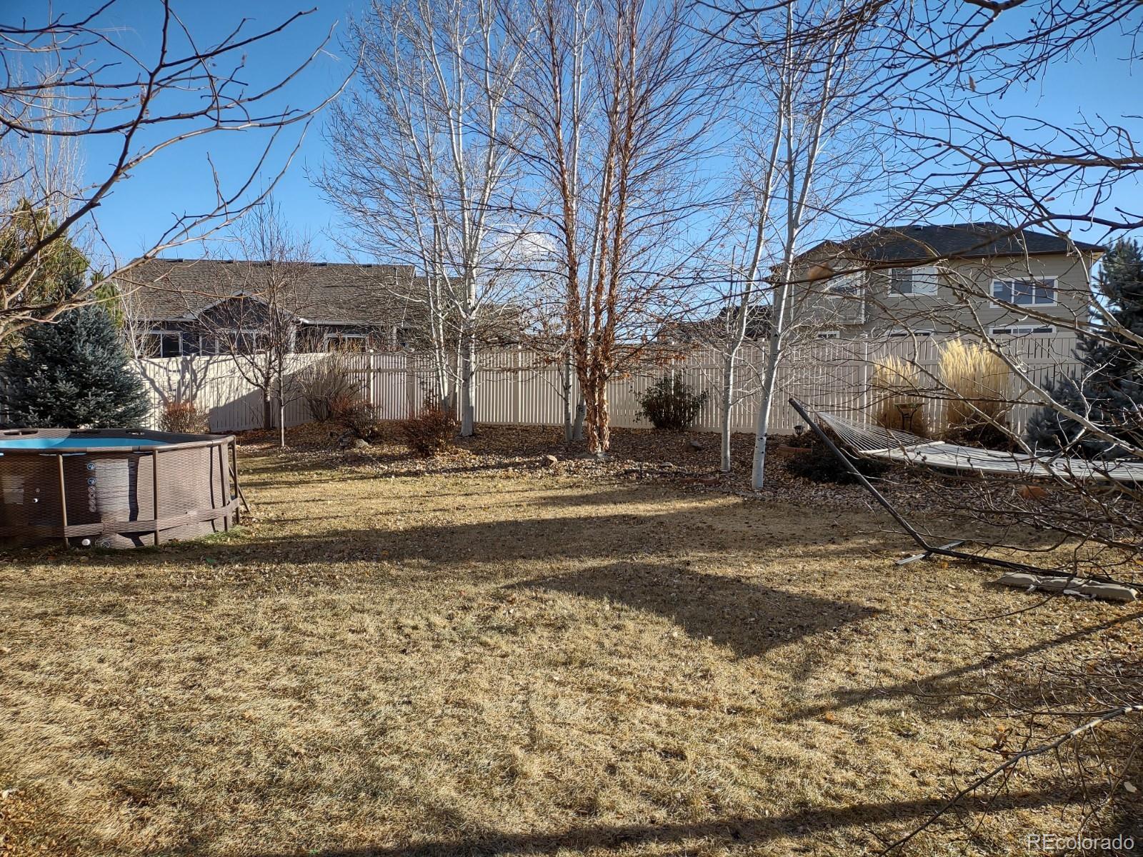 5342 Roadrunner Avenue Firestone, CO 80504 - Photo 19 of 21 a view of a house with a yard