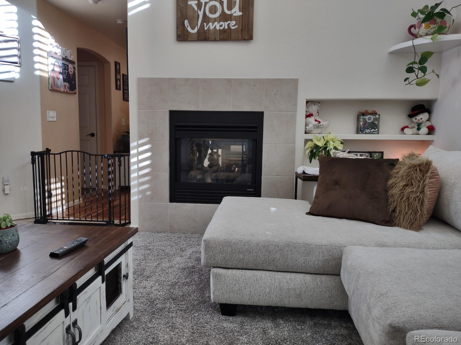 5342 Roadrunner Avenue Firestone, CO 80504 - Photo 4 of 21 a bedroom with a bed and a fireplace