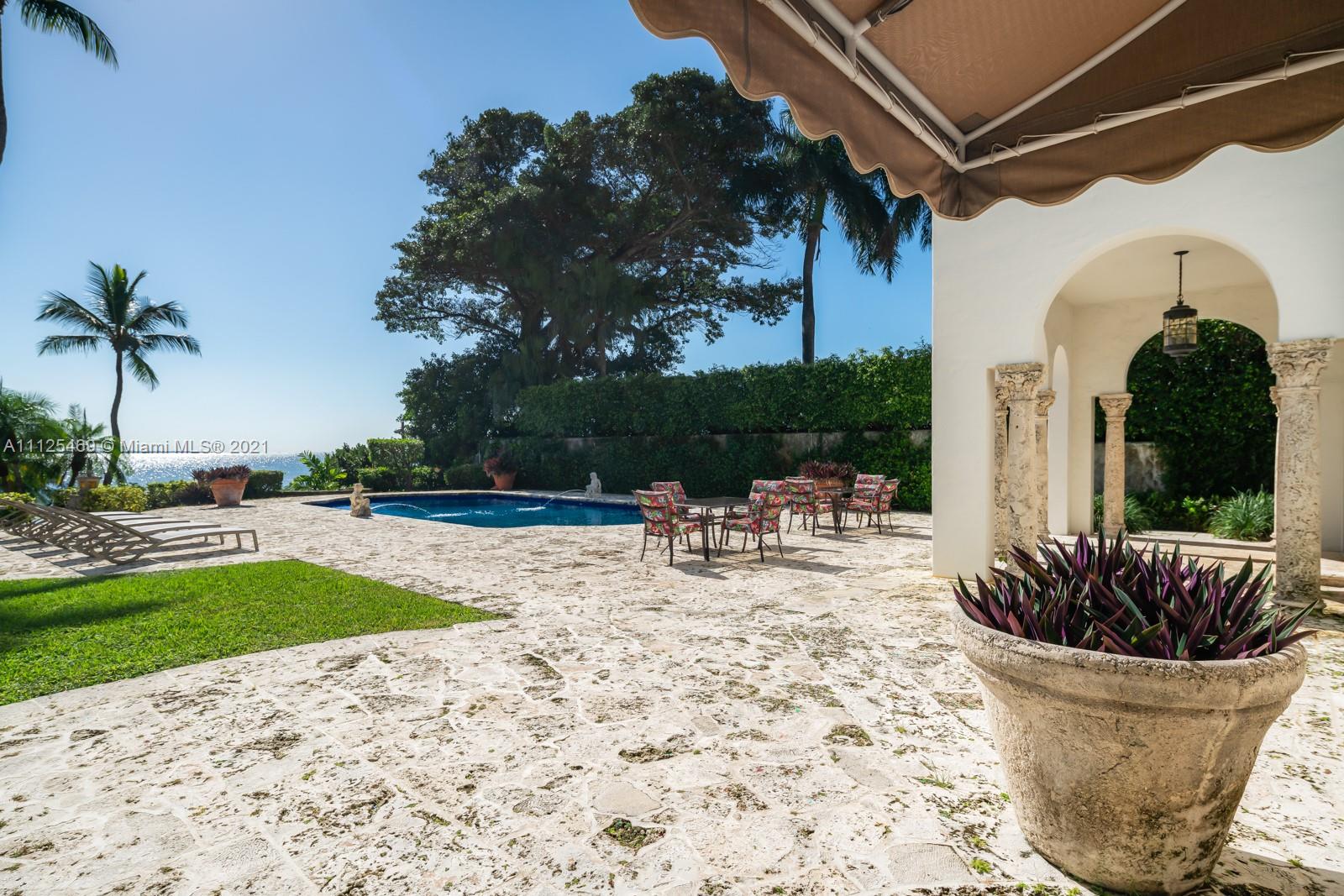 3029 Brickell Avenue Miami, FL 33133 - Photo 11 of 41 a view of a swimming pool with a patio