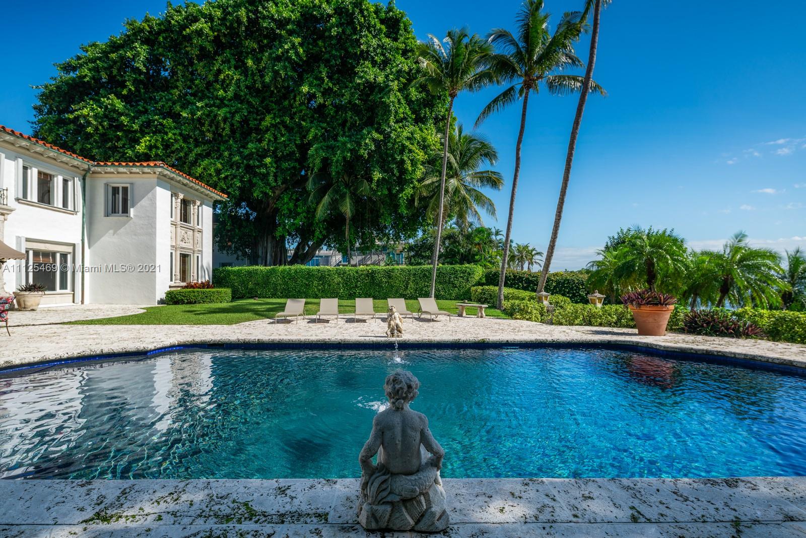 3029 Brickell Avenue Miami, FL 33133 - Photo 12 of 41 a view of backyard with swimming pool and outdoor seating